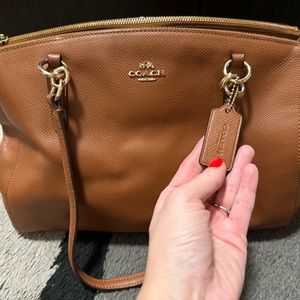 Gently worn authentic leather brown woman’s shoulder bag for sale.